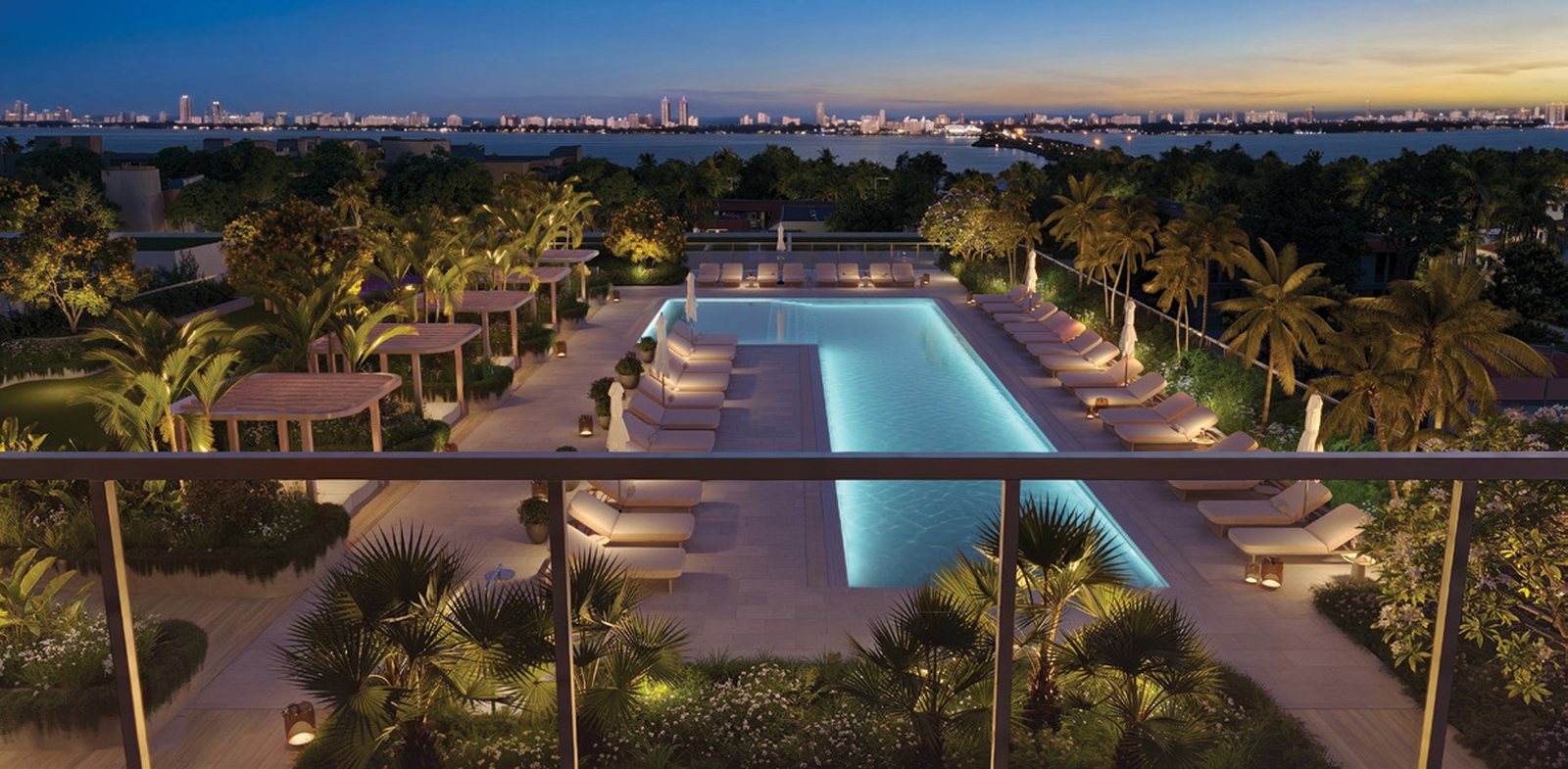 Rendering of the pool deck at dusk with the city lights beyond