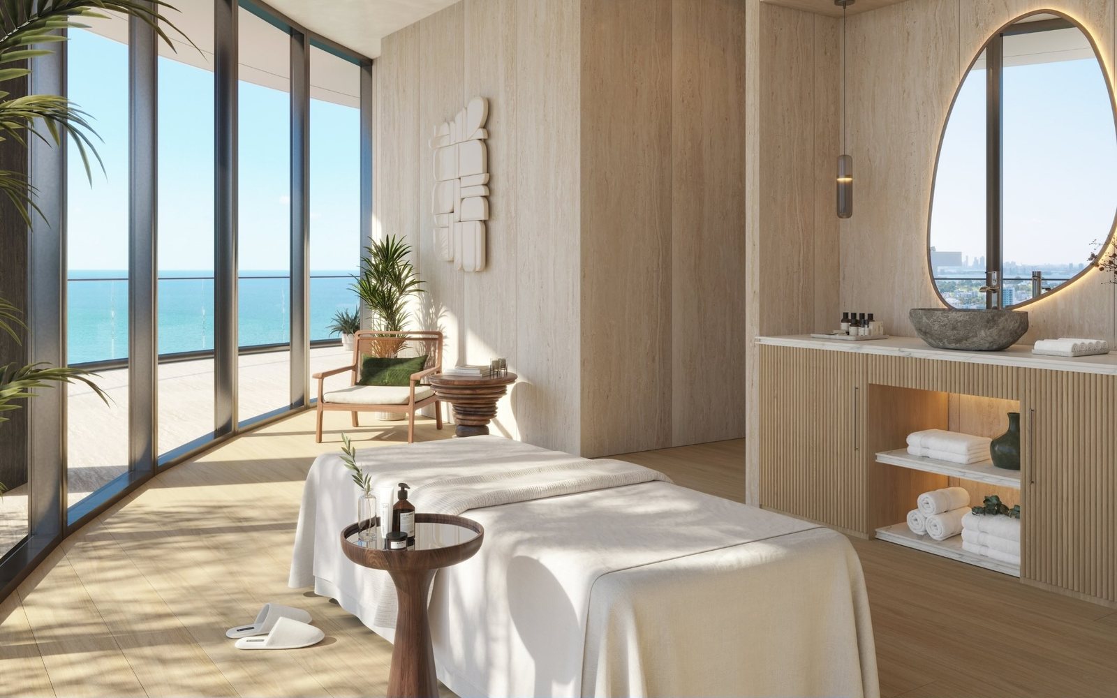 Rendering of the therapy room in the Upper Penthouse with a treatment bed and the ocean through curved glass